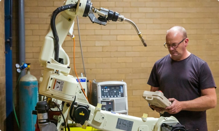 Our in-house tool maker working with one of our impressive manufacturing machines